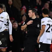 Referee Dean Whitestone reacts after showing a red card to Sheffield United’s Canadian-born striker Daniel Jebbison. (Getty Images)