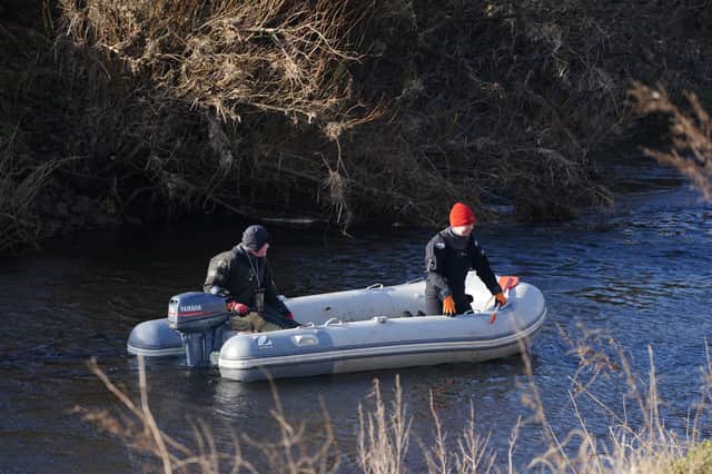 Specialist search officers drive a boat along the River Wyre (Photo: PA)