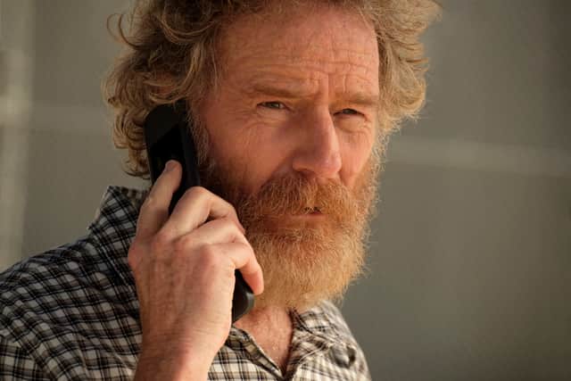 Bryan Cranston as Michael Desiato in Your Honor, bearded and bedraggled, answering the phone (Credit: Andrew Cooper/SHOWTIME)