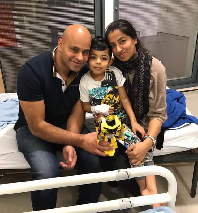 Rayhan Majid in hospital with his mum and dad (Photo: Brain Tumour Research / SWNS)