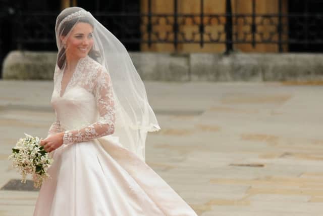 Kate Middleton wowed in an Alexander McQueen bridal dress on her big day. (Photo by BEN STANSALL/AFP via Getty Images)