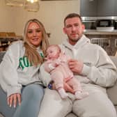 Charlotte, Jake, and their baby