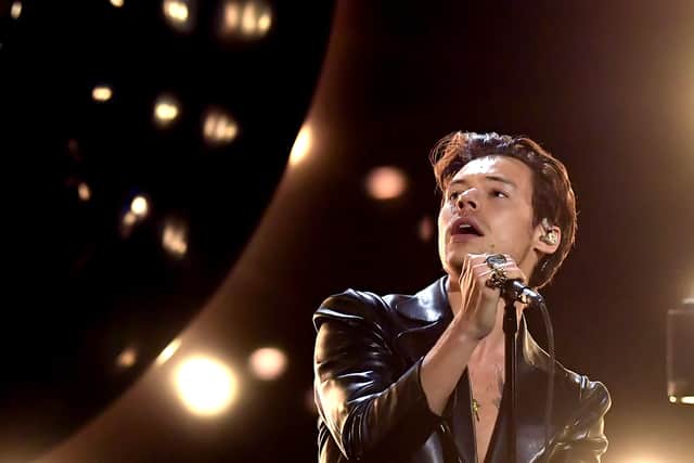 Harry Styles perming at Grammys in 2021. Getty Image. 