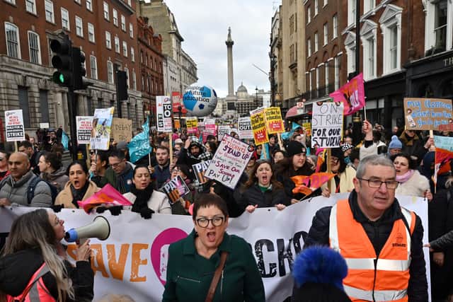Joint General-Secretary of the National Education Union trade union (NEU)  Mary Bousted (C) shouts slogans as she leads a protest organised NEU and other affiliated trade unions in central London, on February 1, 2023