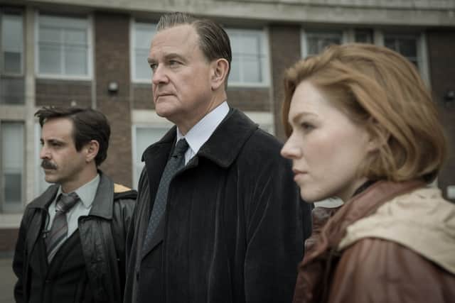 Emun Elliot as Tony Brightwell, Hugh Bonneville as Brian Boyce, and Charlotte Cooper as Nikki Jennings in The Gold (Credit: BBC/Tannadice Pictures/Sally Mais)