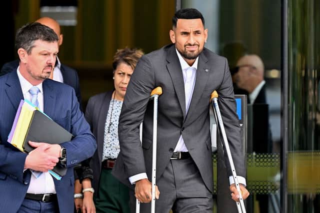 Australian tennis player Nick Kyrgios (R) leaves the magistrate’s court in Canberra on February 3, 2023 (Photo by SAEED KHAN/AFP via Getty Images)