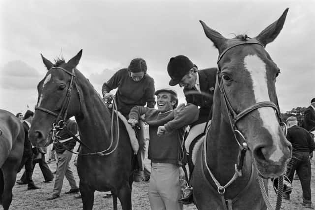 Princess Anne and an another gentleman lifting her then fiance Captain Mark Phillips  at Hickstead, an equestrian centre in West Sussex, England, July 1973.  (Photo by McCarthy/Daily Express/Hulton Archive/Getty Images)