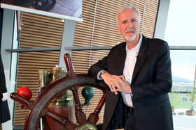 Titanic film director James Cameron with the ship’s wheel from the movie, at the Titanic Belfast museum. A £14 million bid to buy a collection of more than 5,500 artefacts from the Titanic wreck site and bring them to Northern Ireland has been launched. Pic by Paul Faith/PA Wire