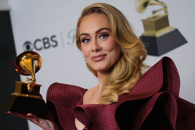 English singer-songwriter Adele poses with the award for Best Pop Solo Performance for “Easy on Me” in the press room during the 65th Annual Grammy Awards at the Crypto.com Arena in Los Angeles on February 5, 2023. (Photo by CHRIS DELMAS/AFP via Getty Images)