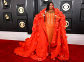 Singer Lizzo wore a statement floral gown from Dolce & Gabbana, complete with cape.