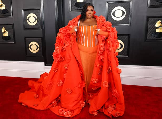 Singer Lizzo wore a statement floral gown from Dolce & Gabbana, complete with cape.