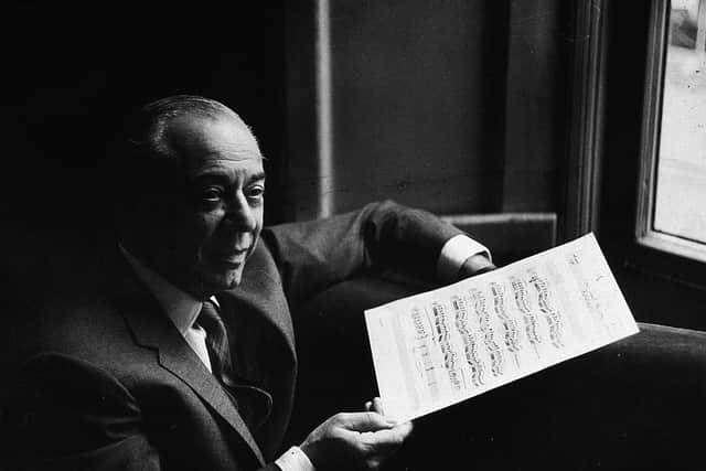 American composer Richard Rodgers (1902 - 1979) smiles and holds a musical score while in rehearsal for the musical, 'The Boys From Syracuse,' written with lyricist Lorenz Hart, London, England, circa 1965. (Photo by Express Newspapers/Getty Images)