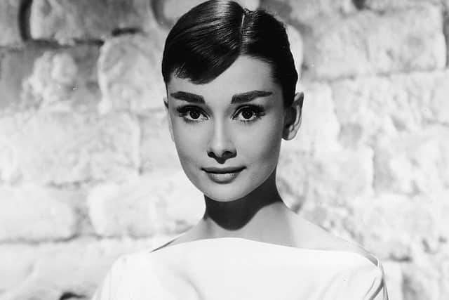 Portrait of Belgian-born American actress Audrey Hepburn (1929 - 1993) in a white long-sleeved dress, mid 1950s. (Photo by /Getty Images)