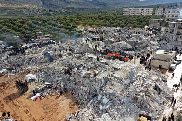 This aerial view shows residents, aided by heavy equipment, searching for victims and survivors after a 7.8 magnitude earthquake on the border between Turkey and Syria (Photo: AFP via Getty Images)