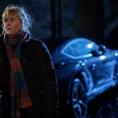 Sarah Lancashire as Catherine Cawood in Happy Valley S3, stood by her car outdoors at night (Credit: BBC/Lookout Point/Matt Squire)
