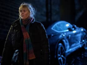 Sarah Lancashire as Catherine Cawood in Happy Valley S3, stood by her car outdoors at night (Credit: BBC/Lookout Point/Matt Squire)