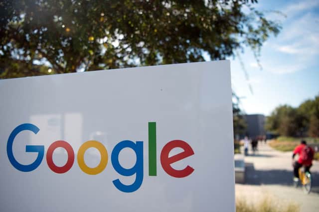 A Google sign and logo at the Googleplex in Mountain View, California on November 4, 2016. (Photo by JOSH EDELSON/AFP via Getty Images)