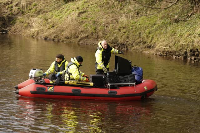 Peter Faulding (right) CEO and workers from private underwater search the river (Photo: PA)