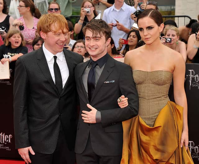(L-R) Rupert Grint, Daniel Radcliffe and Emma Watson attend the New York premiere of “Harry Potter And The Deathly Hallows: Part 2” at Avery Fisher Hall, Lincoln Center on July 11, 2011 in New York City.  (Photo by Stephen Lovekin/Getty Images)