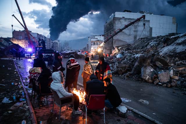 Earthquake survivors wait for news of her loved ones in Iskenderun, Turkey (Image: Getty)