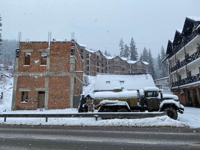 A Soviet ZIL-131 sits beside an unfinished construction project in Bukovel (Image:  William Montgomery)