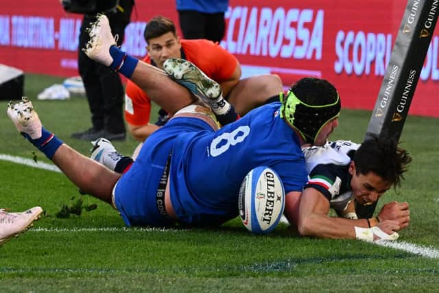 Ange Capuozzo scores a try against France