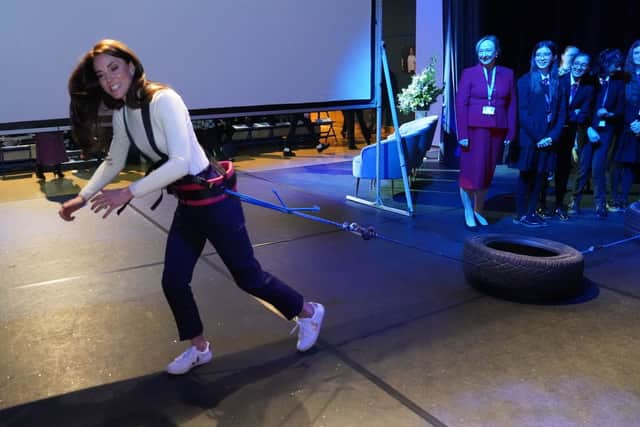 Action girl Kate Middleton tried her hand at tyre pulling. (Photo by ARTHUR EDWARDS/POOL/AFP via Getty Images)