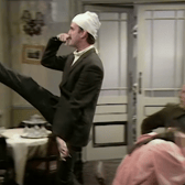 Basil Fawlty goose steps in front of German guests in Fawlty Towers