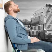 Composite image of a man waiting in A&E and an ambulance