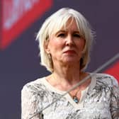 Nadine Dorries looks on from the podium following the F1 Grand Prix of Great Britain at Silverstone on July 03, 2022 in Northampton, England. (Photo by Mark Thompson/Getty Images)