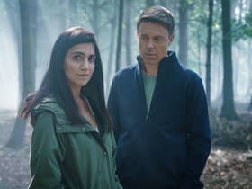 Leila Farzad as Lou and Andrew Buchan as Col in Better, stood in the forrest (Credit: BBC/Sister Pictures/Ross Fergusan)