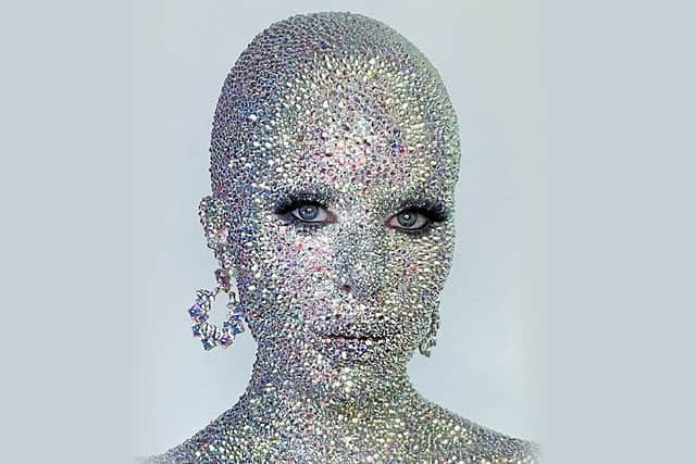 Makeup creative Holly Murray has covered herself in thousands of rhinestones, just like singer Doja Cat did at Paris Fashion Week in January 2023.