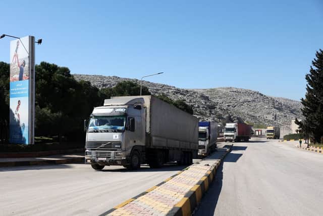 A United Nations aid convoy enters rebel-held northwestern Syria from Turkey through the Bab el-Hawa crossing on February 9, the first since a devastating earthquake that killed thousands (Photo by OMAR HAJ KADOUR/AFP via Getty Images).