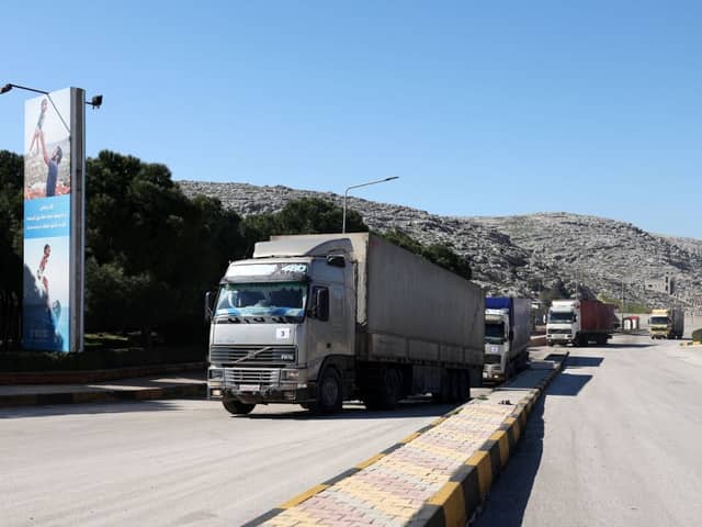 A United Nations aid convoy enters rebel-held northwestern Syria from Turkey through the Bab el-Hawa crossing on February 9, the first since a devastating earthquake that killed thousands (Photo by OMAR HAJ KADOUR/AFP via Getty Images).