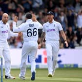 Ben Stokes (R) celebrates with Jack Leach (L) and Joe Root following win over New Zealand in June 2022