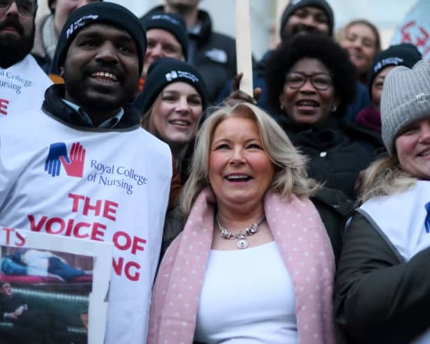 Britain’s Royal College of Nursing (RCN) union head Pat Cullen (C) joins striking nurses at a picket line outside University College Hospital in London. Credit: DANIEL LEAL/AFP via Getty Images