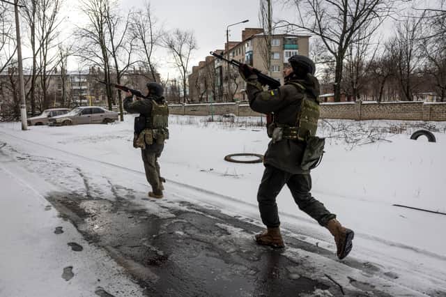 BAKHMUT, UKRAINE - FEBRUARY 14: Ukrainian soldiers scan an apartment block after hearing a shot fired while on patrol on February 14, 2023 in Bakhmut, Ukraine. (Credit: Getty Images)