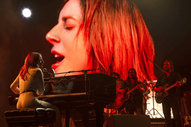 Lady Gaga performing alongside Bradley Cooper in A Star is Born (Credit: Warner Discovery)