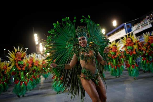 Members of Unidos da Tijuca samba school perform during the second night of Rio's Carnival parade at the Sambadrome Marques de Sapucai in Rio de Janeiro, Brazil, in the early hours of April 24, 2022. (Photo by Mauro PIMENTEL / AFP) (Photo by MAURO PIMENTEL/AFP via Getty Images)