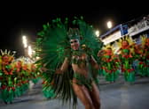 Members of Unidos da Tijuca samba school perform during the second night of Rio's Carnival parade at the Sambadrome Marques de Sapucai in Rio de Janeiro, Brazil, in the early hours of April 24, 2022. (Photo by Mauro PIMENTEL / AFP) (Photo by MAURO PIMENTEL/AFP via Getty Images)