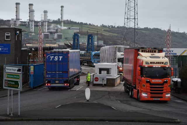 Port officers inspect vehicles at a harbour checkpoint in Larne, Northern Ireland. Credit: Getty Images