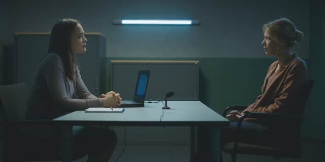 A police officer confronts a suspect over an interrogation table in a scene from Sacha (Credit: Walter Presents)