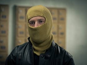 Adam Nagaitis as Brink’s Mat robber Micky McAvoy in The Gold, wearing a balaclava (Credit: BBC/Tannadice Pictures/Sally Mais)