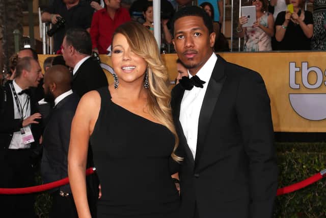 Singer-actress Mariah Carey and TV personality Nick Cannon attend the 20th Annual Screen Actors Guild Awards at The Shrine Auditorium on January 18, 2014 in Los Angeles, California.  (Photo by Frederick M. Brown/Getty Images)
