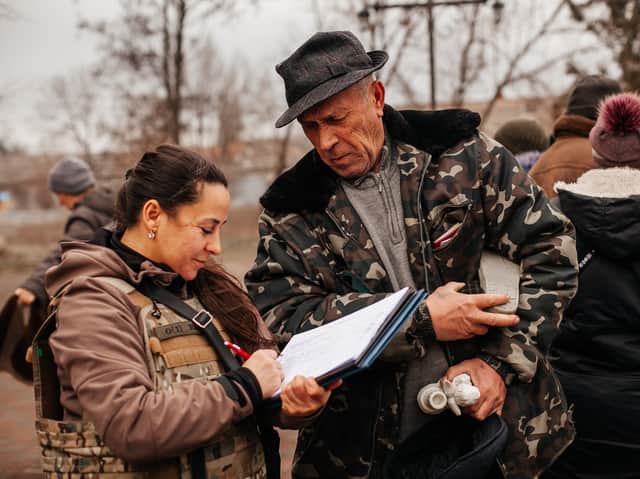 Anna from Heritage Ukraine delivering winter supplies to a village in range of Russian artillery (Image: Christian Aid)
