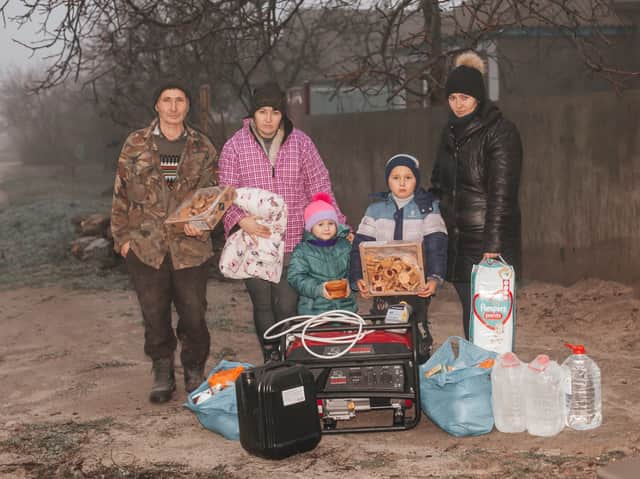 A family with a home winter kit (Image: Christian Aid)