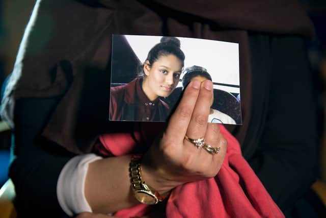 Photograph of Shamima Begum held up by her eldest sister (Photo: Getty Images)