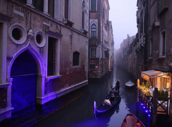 A gondola makes its way along a narrow canal during normal water levels (Photo: Getty Images)