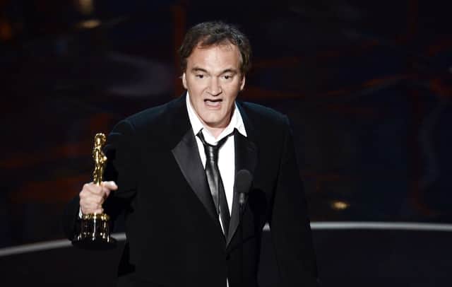 Writer/director Quentin Tarantino accepts the Best Writing - Original Screenplay award for "Django Unchained" onstage during the Oscars held at the Dolby Theatre on February 24, 2013 in Hollywood, California.  (Photo by Kevin Winter/Getty Images)