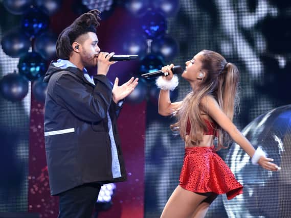 Recording artists The Weeknd (L) and Ariana Grande perform onstage during KIIS FM's Jingle Ball 2014  powered by LINE at Staples Center on December 5, 2014 in Los Angeles, California.  (Photo by Kevin Winter/Getty Images for iHeartMedia)
